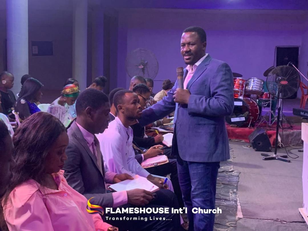 People on stage in white garments